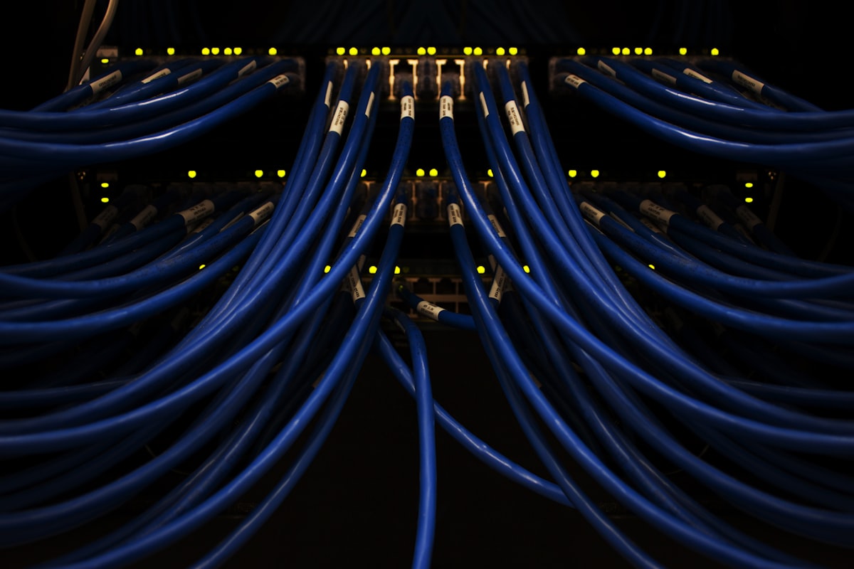 Fiber and network cables connected to infrastructure equipment